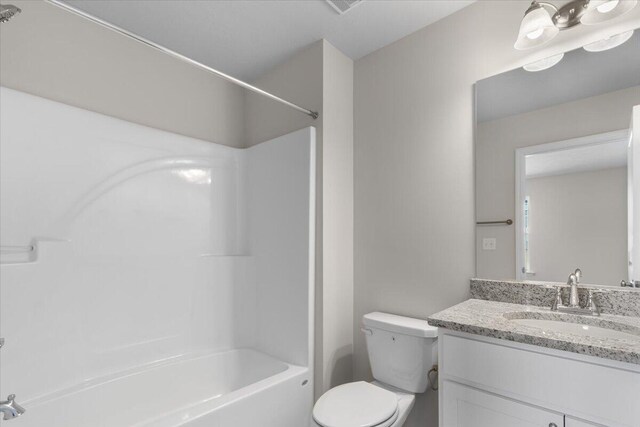 full bathroom featuring vanity, toilet, and shower / washtub combination