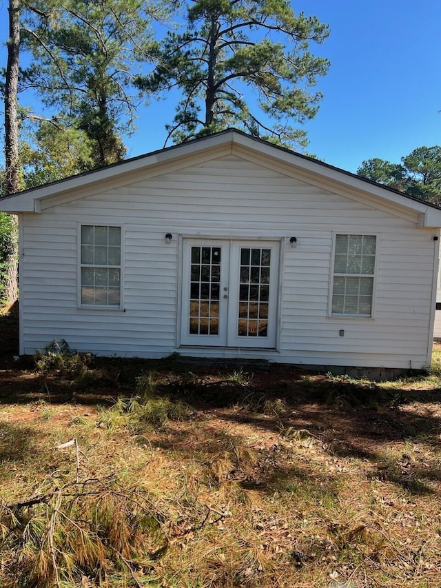 back of property featuring french doors