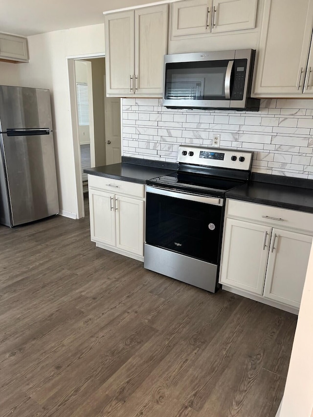 kitchen with backsplash, dark wood-type flooring, and stainless steel appliances