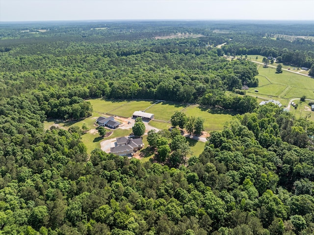 view of rural area with a forest