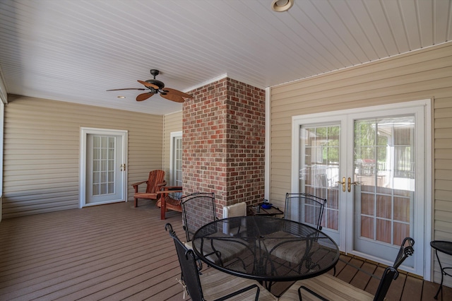 deck featuring a ceiling fan, outdoor dining space, and french doors