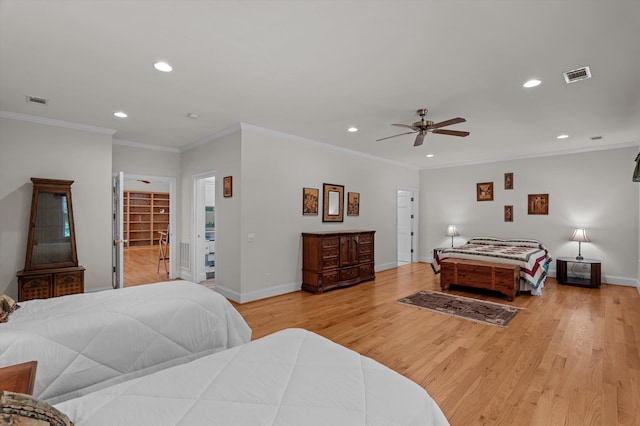 bedroom with recessed lighting, light wood-style floors, baseboards, crown molding, and a ceiling fan