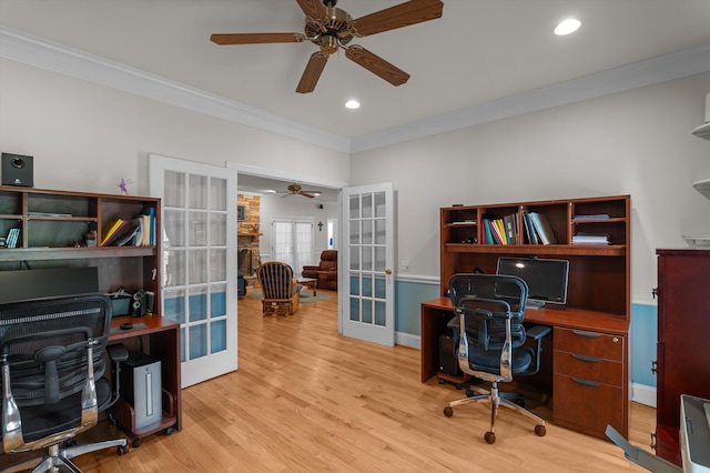 office featuring french doors, a ceiling fan, ornamental molding, light wood-style flooring, and recessed lighting