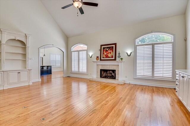 3954 Hammonds Fry, Evans, GA 30809 - unfurnished living room featuring ceiling fan, high vaulted ceiling, a fireplace, and light wood-style flooring