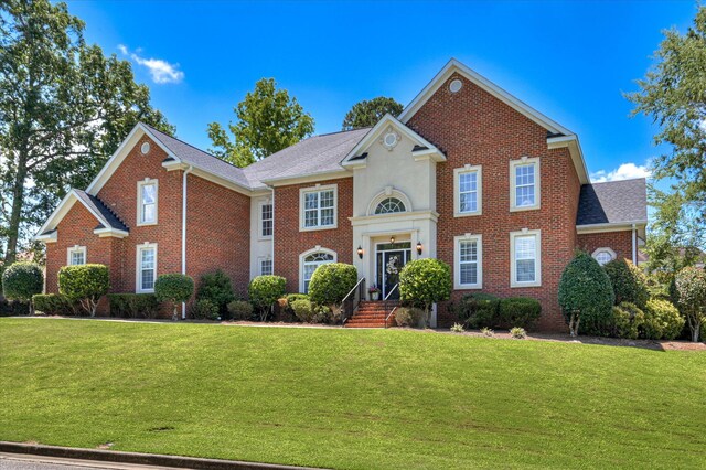3954 Hammonds Fry, Evans, GA 30809 - georgian-style home featuring brick siding, a front yard, and a shingled roof