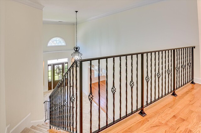 3954 Hammonds Fry, Evans, GA 30809 - stairway featuring crown molding, a towering ceiling, and wood finished floors