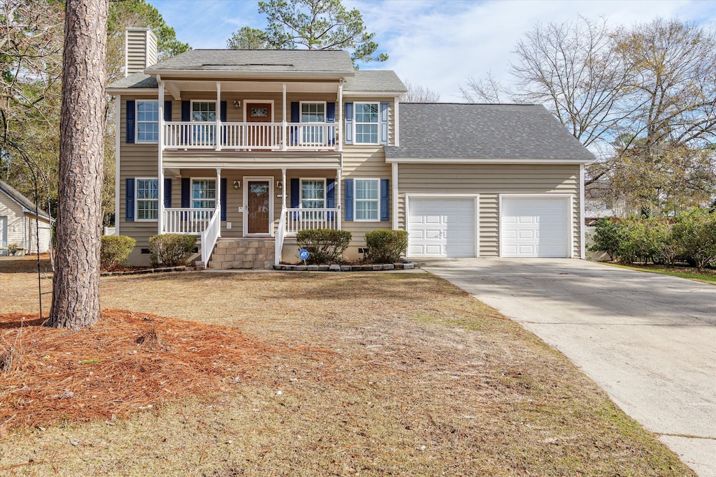 view of front of home with covered porch and a garage