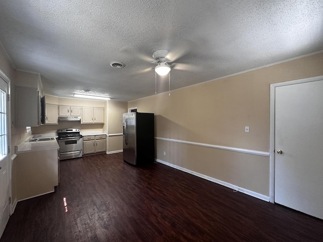 kitchen with sink, dark hardwood / wood-style floors, ceiling fan, appliances with stainless steel finishes, and white cabinetry