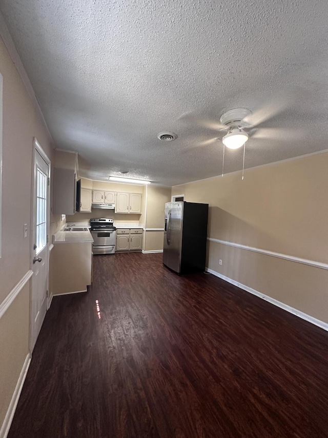 kitchen featuring white cabinetry, sink, ceiling fan, dark hardwood / wood-style flooring, and appliances with stainless steel finishes