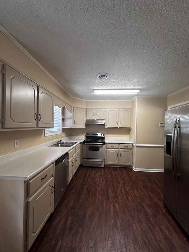 kitchen with a textured ceiling, stainless steel appliances, dark hardwood / wood-style floors, and sink