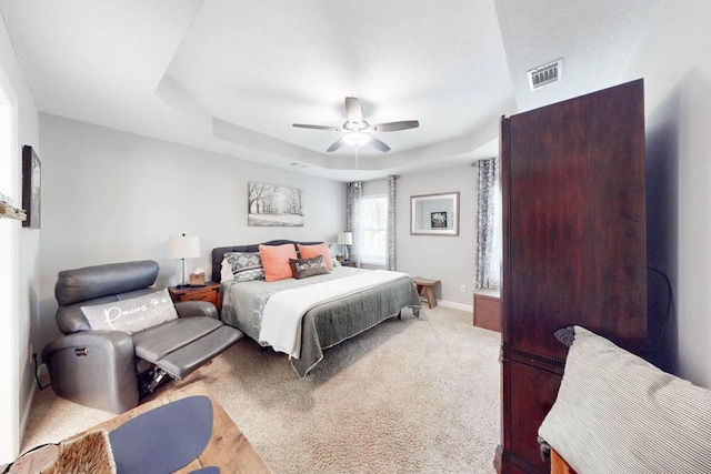10 Weyanoke Ct, Aiken, SC 29803 - bedroom with a tray ceiling, a ceiling fan, and baseboards
