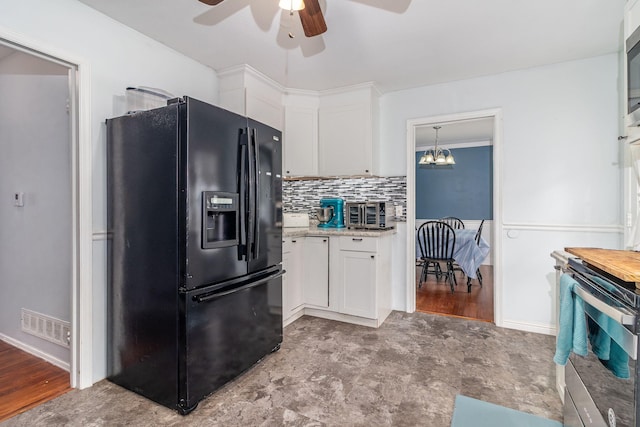 2211 Mura Dr, Augusta, GA 30906 - kitchen featuring stainless steel appliances, a ceiling fan, white cabinets, a chandelier, and tasteful backsplash