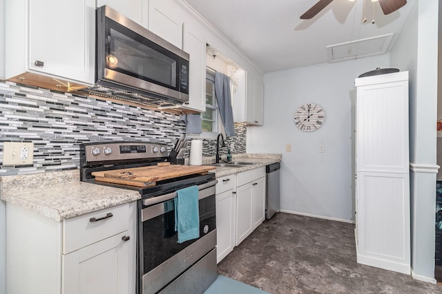 2211 Mura Dr, Augusta, GA 30906 - kitchen with stainless steel appliances, a ceiling fan, backsplash, and a sink
