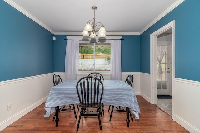 2211 Mura Dr, Augusta, GA 30906 - dining area featuring a chandelier, wood finished floors, ornamental molding, and a wainscoted wall