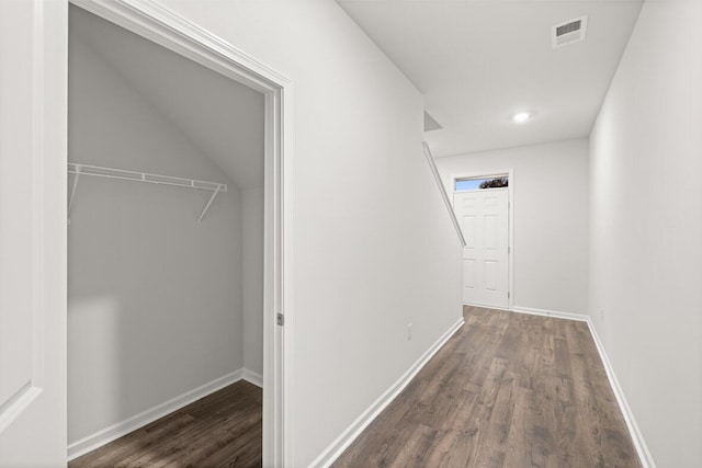 corridor with dark hardwood / wood-style floors