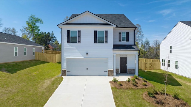 view of front of house with a garage and a front yard