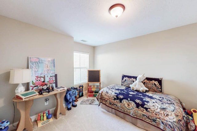 bedroom with carpet and visible vents