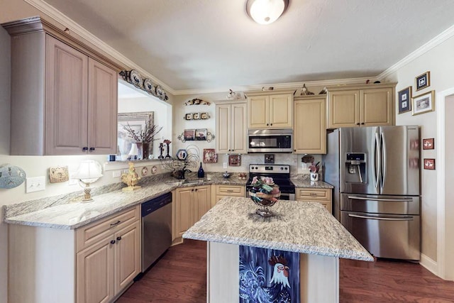 kitchen featuring light stone counters, dark wood-style flooring, crown molding, stainless steel appliances, and a kitchen island