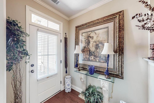 entryway with dark wood-style floors, a healthy amount of sunlight, crown molding, and visible vents