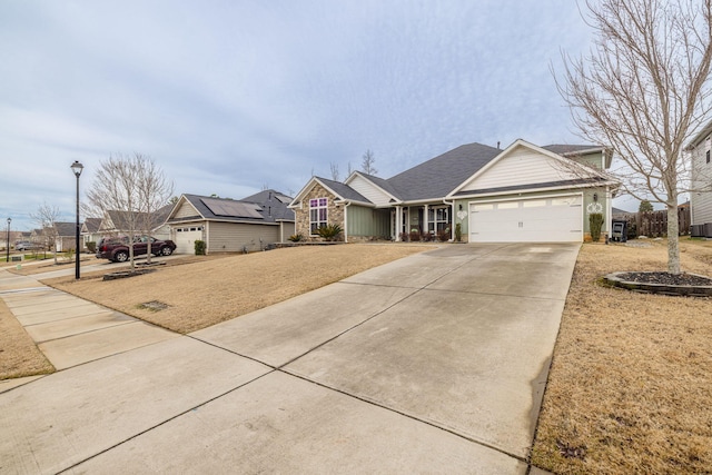 single story home with a garage, a front lawn, and central air condition unit