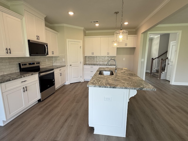 254 Prominence Dr Unit Tp52, Grovetown, GA 30813 - kitchen with stainless steel electric stove, a sink, dark wood-style floors, white cabinets, and dark stone counters