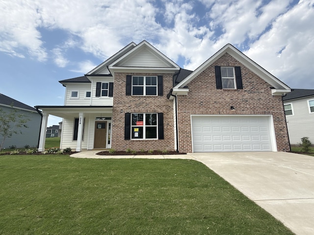 254 Prominence Dr Unit Tp52, Grovetown, GA 30813 - view of front of house featuring driveway, brick siding, a front yard, and an attached garage