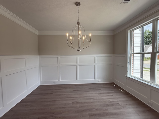 254 Prominence Dr Unit Tp52, Grovetown, GA 30813 - unfurnished dining area featuring a decorative wall, healthy amount of natural light, a chandelier, crown molding, and dark wood finished floors