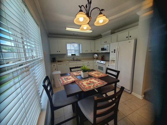 501 Capstone Way, Grovetown, GA 30813 - kitchen featuring white appliances, a chandelier, light countertops, light tile patterned floors, and white cabinets