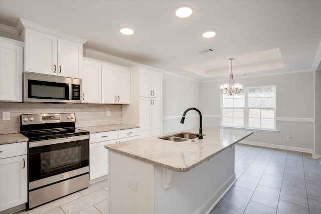 913 Goodale Dr, Augusta, GA 30909 - tiled dining room with a chandelier, a raised ceiling, and plenty of natural light