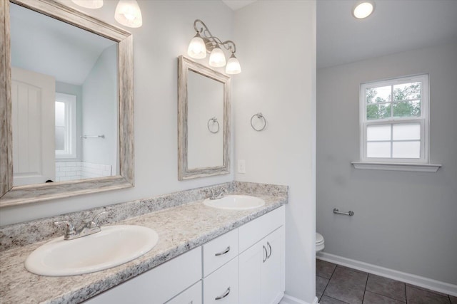 913 Goodale Dr, Augusta, GA 30909 - bathroom with tile patterned flooring, vanity, toilet, and vaulted ceiling