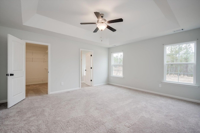 913 Goodale Dr, Augusta, GA 30909 - bedroom featuring a tray ceiling, ceiling fan, and light carpet