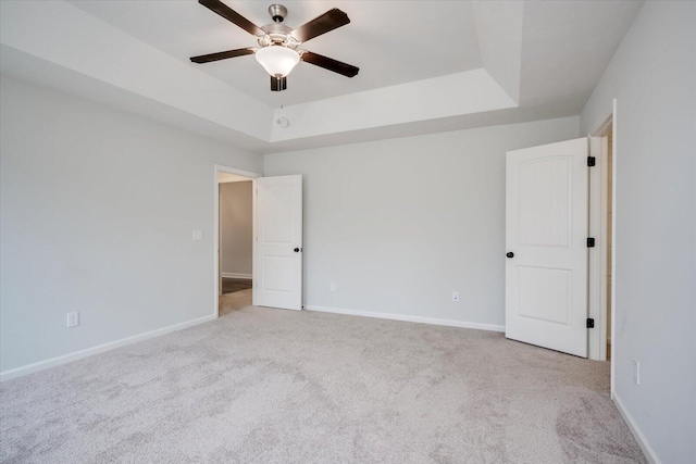 913 Goodale Dr, Augusta, GA 30909 - bedroom featuring a tray ceiling, ceiling fan, light colored carpet, and ensuite bathroom