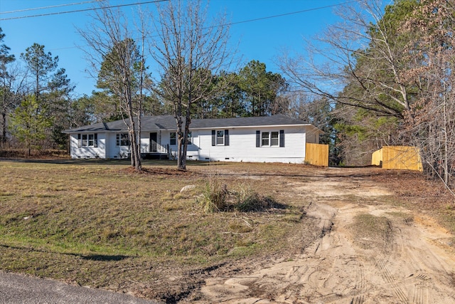 ranch-style house with a front yard