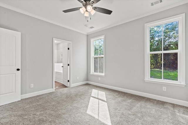 unfurnished bedroom with ceiling fan, crown molding, connected bathroom, and carpet flooring