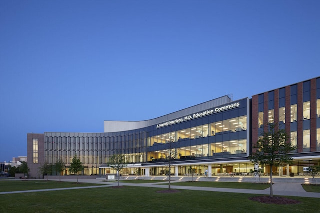 view of outdoor building at dusk