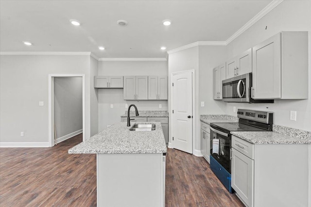 kitchen with sink, light stone countertops, an island with sink, stainless steel appliances, and dark hardwood / wood-style flooring