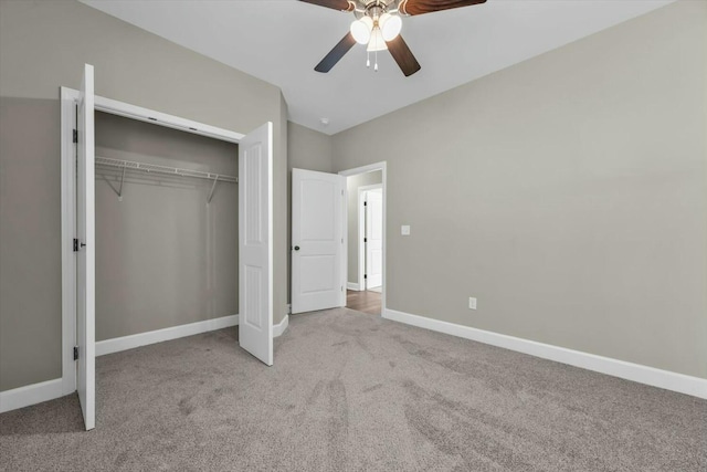 unfurnished bedroom featuring ceiling fan, carpet floors, a closet, and baseboards