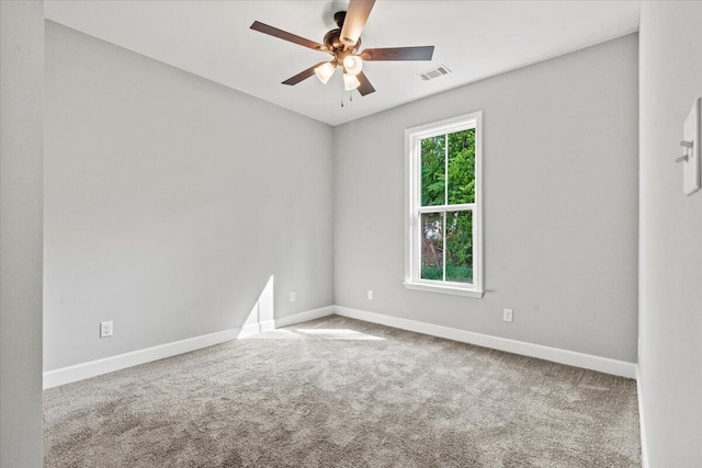 carpeted empty room featuring ceiling fan