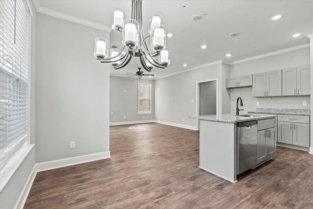 kitchen featuring ceiling fan, dishwasher, a kitchen island with sink, gray cabinetry, and light stone counters