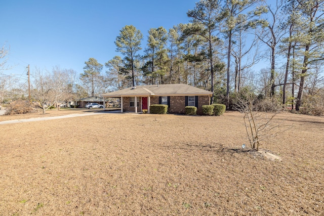 ranch-style house featuring a carport