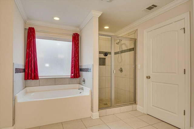 bathroom with tile patterned floors, ornamental molding, and shower with separate bathtub