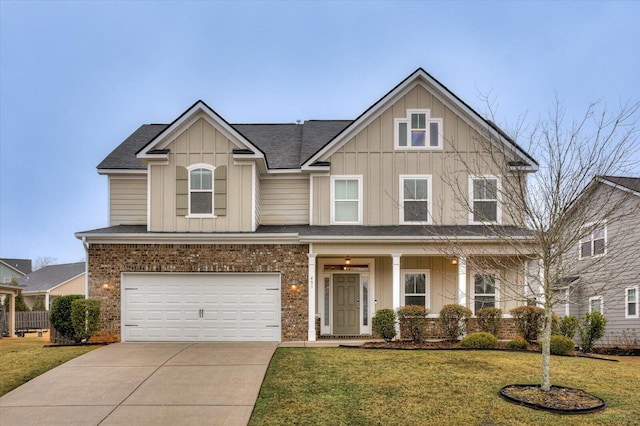 view of front of house with a garage and a front lawn