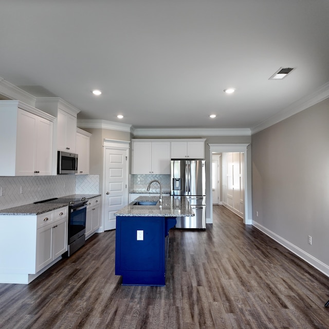333 Sumac Trl, Evans, GA 30809 - kitchen with ornamental molding, appliances with stainless steel finishes, backsplash, white cabinetry, and dark wood-type flooring