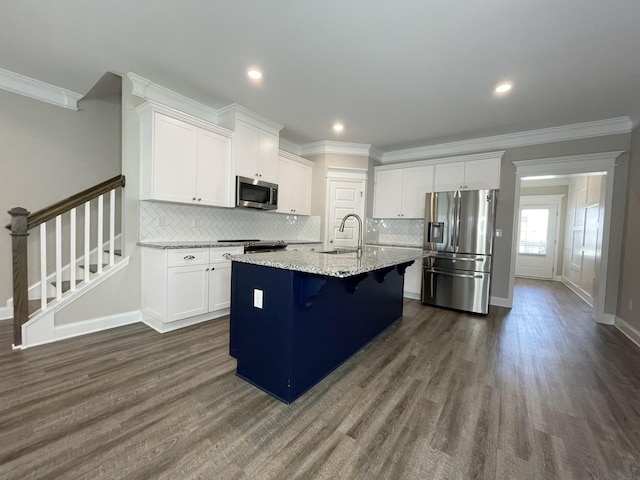 333 Sumac Trl, Evans, GA 30809 - kitchen with stainless steel appliances, dark wood finished floors, ornamental molding, white cabinets, and backsplash