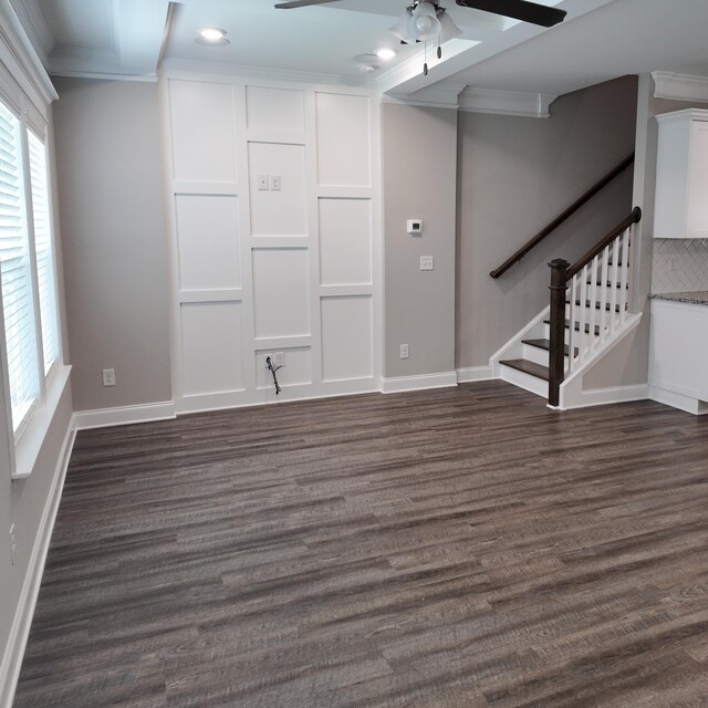 333 Sumac Trl, Evans, GA 30809 - unfurnished living room with ceiling fan, dark wood finished floors, crown molding, and stairs