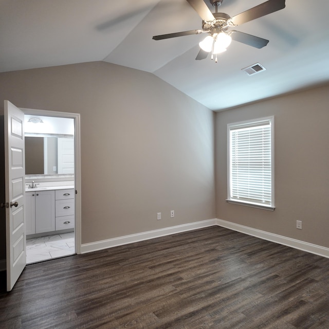 333 Sumac Trl, Evans, GA 30809 - unfurnished bedroom with vaulted ceiling, connected bathroom, wood finished floors, and ceiling fan