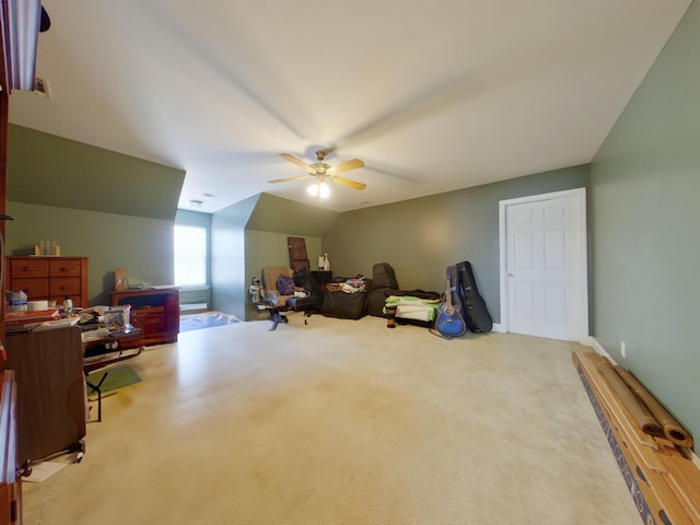 recreation room with a ceiling fan, lofted ceiling, and carpet floors