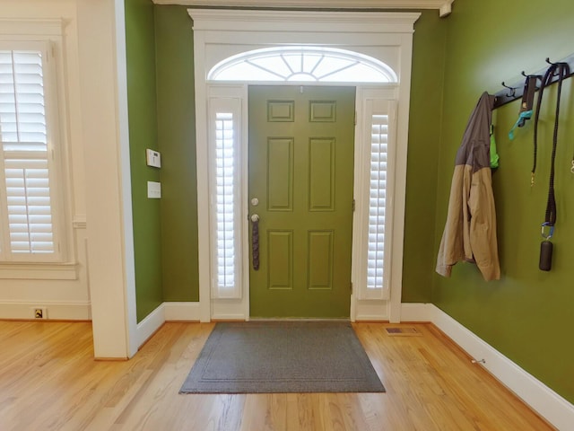 foyer featuring a wealth of natural light and light wood-style floors