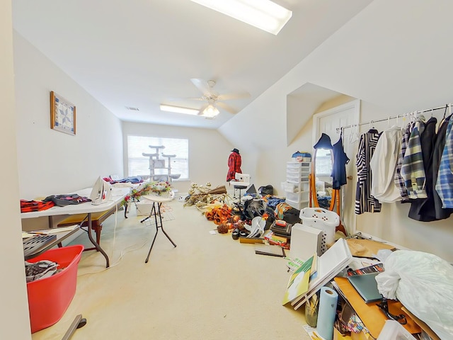 playroom with carpet flooring, visible vents, a ceiling fan, and vaulted ceiling