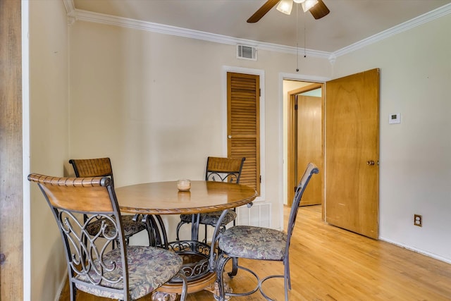 3414 Forest Estates Dr, Augusta, GA 30909 - dining space featuring light wood-style floors, a ceiling fan, and ornamental molding